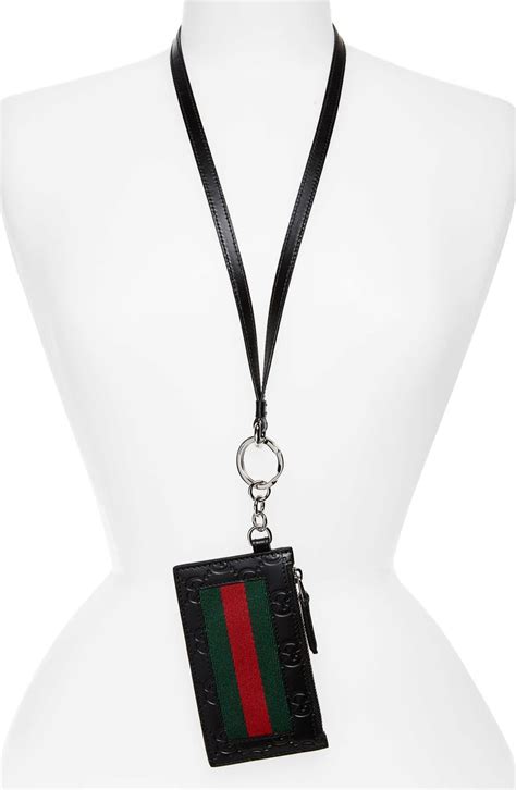 gucci card case with lanyard.